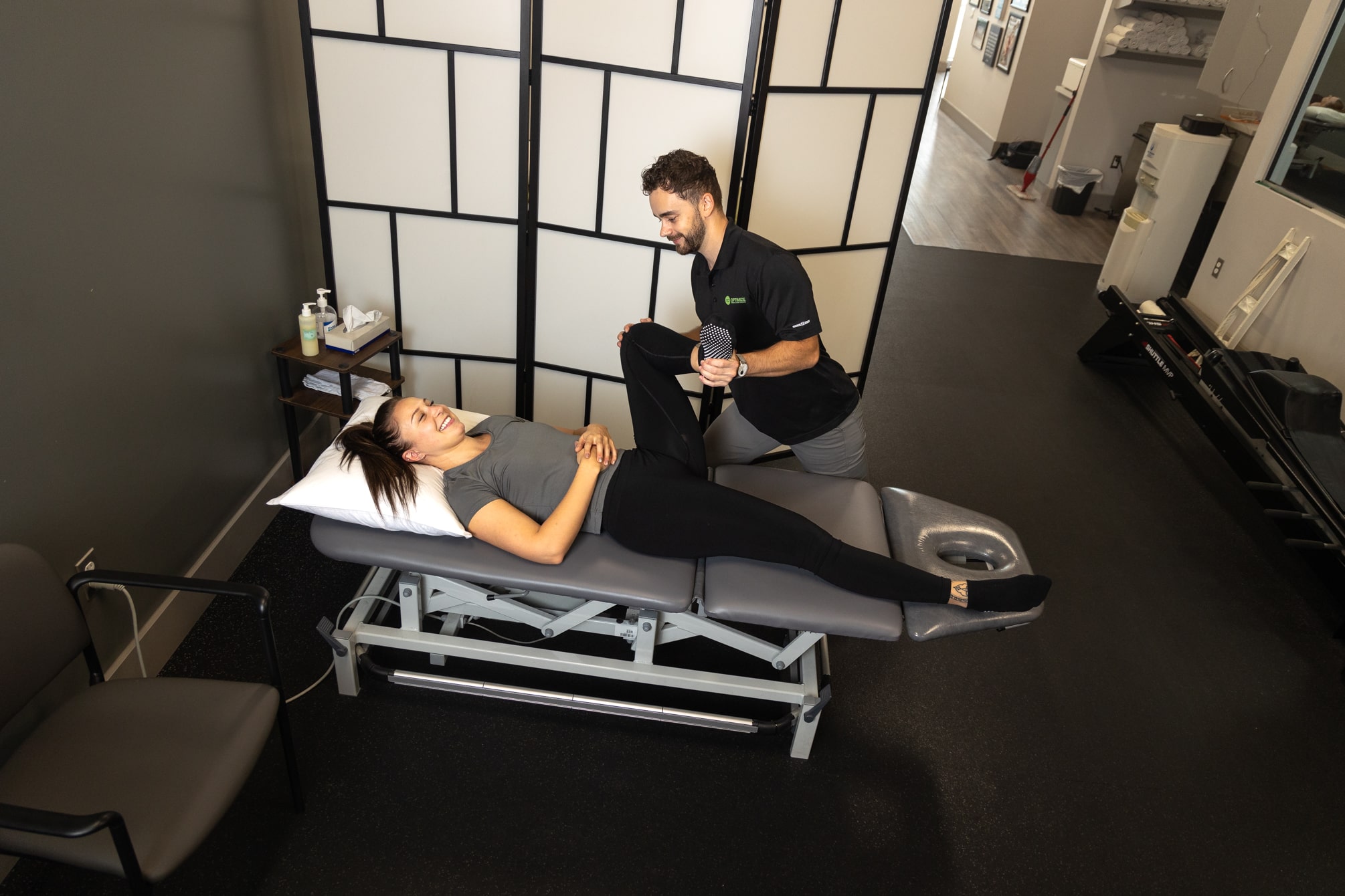 physiotherapist stretching a patient